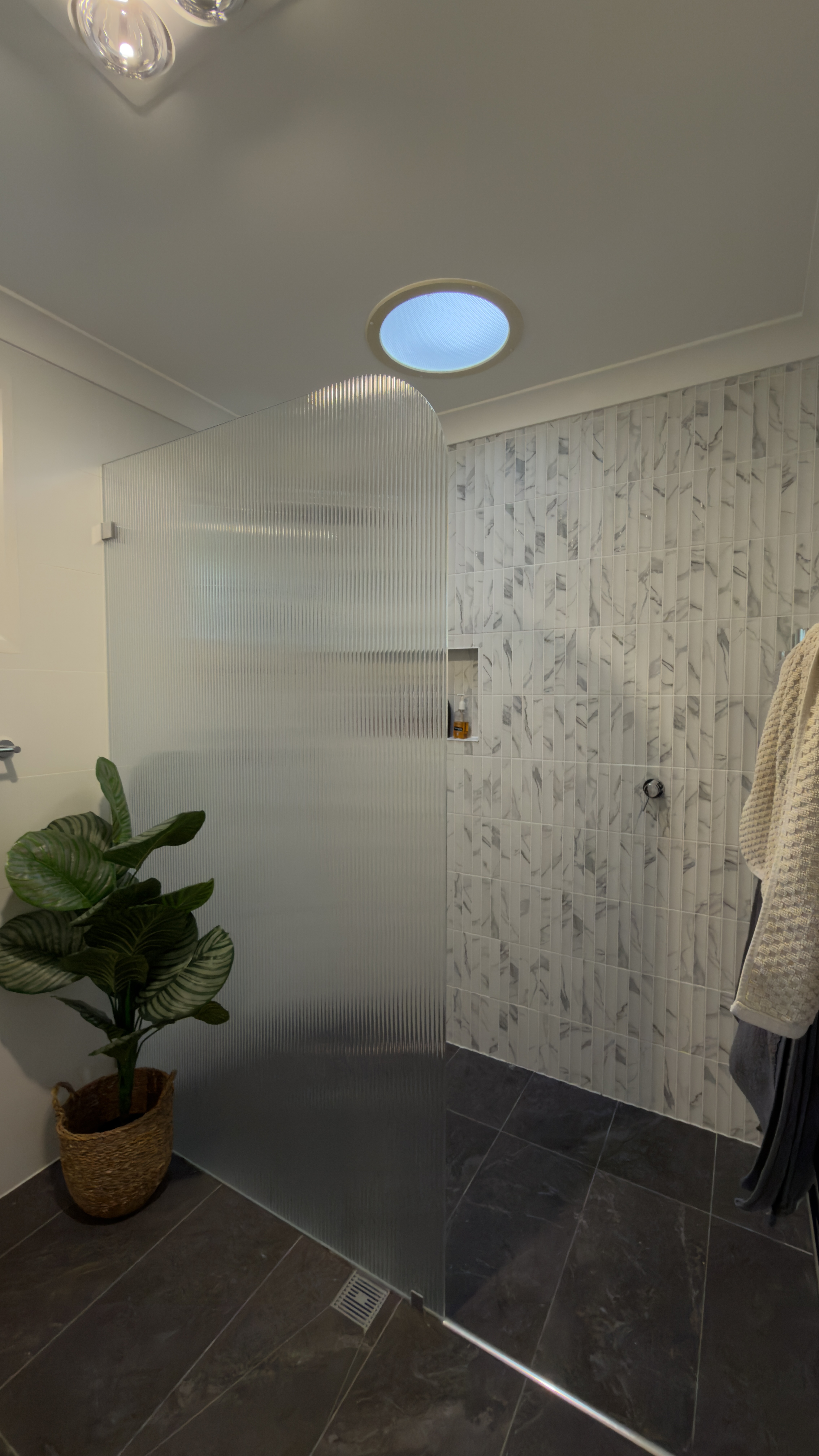 Bathroom renovation detail with tiled wet area finishes