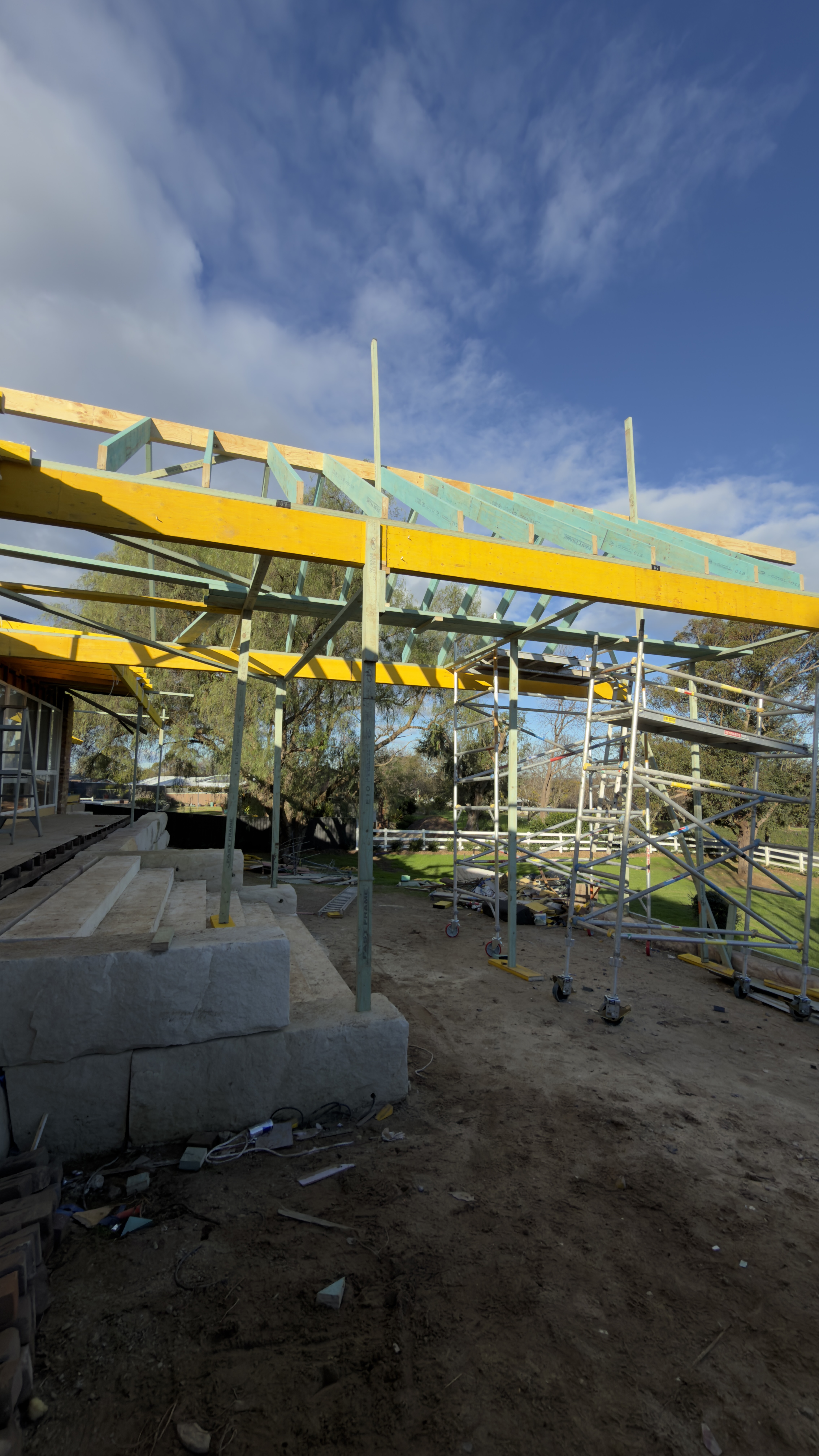 Roof framing and scaffolding during residential extension work