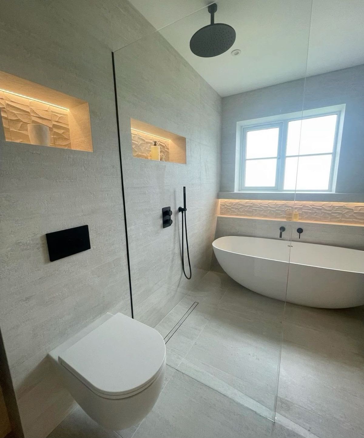 Completed bathroom fit-out with floor-to-ceiling tiles