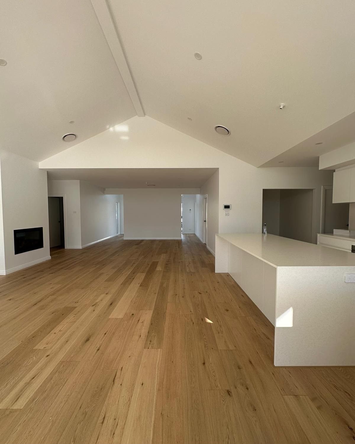 Renovated kitchen with modern cabinetry and splashback